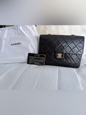CHANEL Black Quilted Shoulder Flap Bag with Gold CC. (Size small)